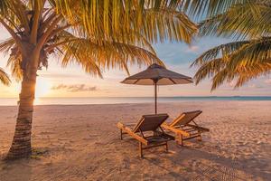 Amazing beach. Romantic chairs sandy beach sea sky. Couple summer holiday vacation for tourism destination. Inspirational tropical landscape. Tranquil scenic relax beach beautiful landscape background