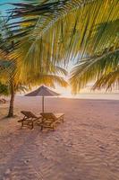 Amazing beach. Romantic chairs sandy beach sea sky. Couple summer holiday vacation tourism destination. Inspire tropical landscape. Tranquil scenic relax beach beautiful vertical landscape background photo