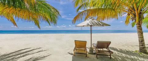 Amazing vacation beach. Couple chairs together by the sea banner. Summer romantic holiday honeymoon concept. Tropical island landscape. Tranquil shore panorama, relax sand seaside horizon, palm leaves