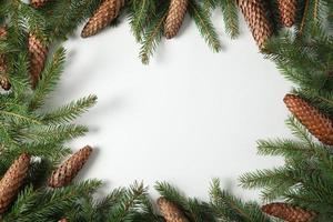 New Year's Eve background with fir branch and cones. Christmas and New Year holidays composition of pine tree branches. Happy New Year 2023 photo