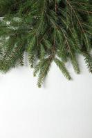 New Year's Eve background with fir branch and cones. Christmas and New Year holidays composition of pine tree branches. Happy New Year 2023 photo