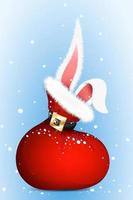 Santa's bag under the snowfall with rabbit ears sticking out of it. Concept of Christmas and Chinese New Year. vector