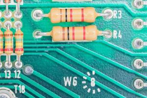 Condensers and Resistor assembly on the circuit board photo