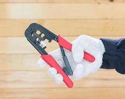 Hand in glove hold wire stripper photo