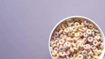 Overhead view of fruit circle cereal in a bowl video