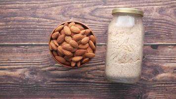 A bowl with almonds and a jar with almond flour video