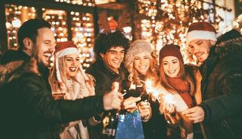 Friends With Sparklers At The New Year Party photo