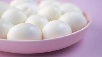 Pink dish full of hard boiled eggs video