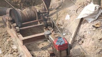 Machine with belts and pulleys at construction site video