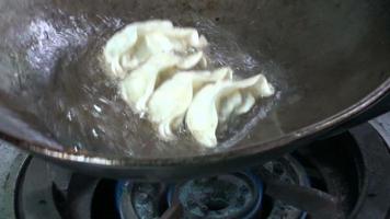 fried dumplings in a pan video
