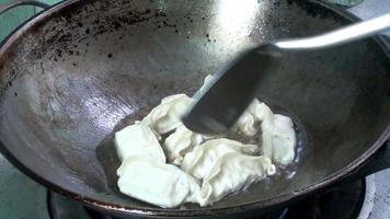 fried dumplings in a pan , time lapse video