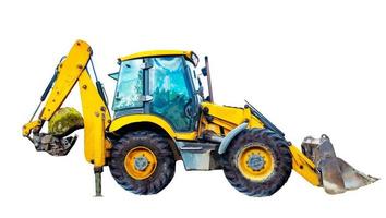 A large yellow multifunctional wheeled tractor isolated on white background. photo