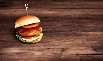 Chicken burger. Fresh tasty burger with fried chicken meat. photo