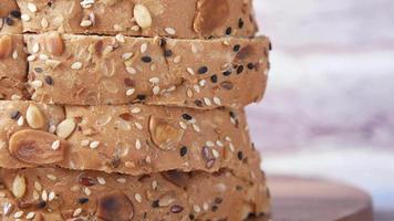 Close up shot of bread slices, covered with sesame and nuts video