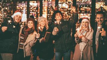 Friends With Sparklers At The New Year Party photo