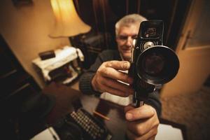 Senior Man Holding Video Camera photo