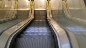 An escalator going down top view video