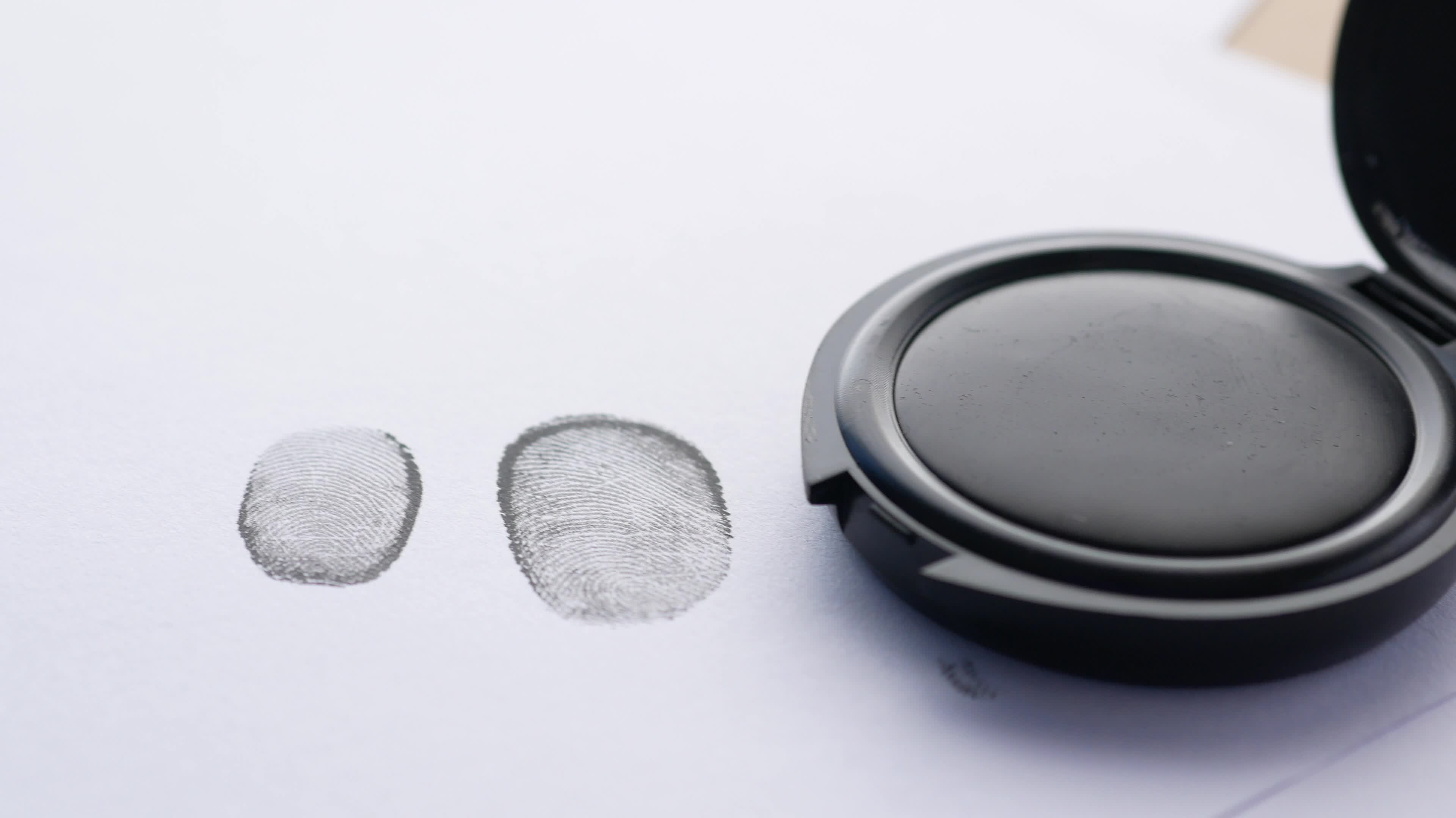 A stamp pad and fingerprints on paper 14062785 Stock Video at Vecteezy