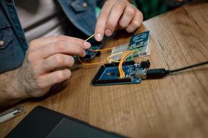 Engineer Working On Circuit Board photo