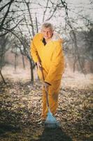 Cleaning Orchard With A Rake photo