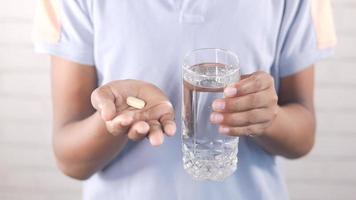 Taking a pills with a glass of water video