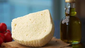 A piece of white bread and olive oil, close up video