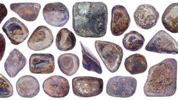 Bronzite jewel stones set texture on white light isolated background. Moving right seamless loop backdrop. video