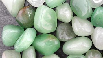 Green Aventurine heap up jewel texture background. Moving right seamless loop backdrop. video