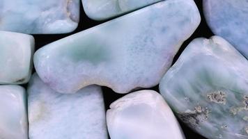 Larimar jewel heap texture. Pile mineral pebbles background. Moving right seamless loop backdrop. video
