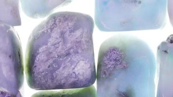 Larimar jewel texture on light surface background. Moving right seamless loop backdrop. video