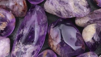 Rutilated amethyst jewel heap texture. Moving right seamless loop backdrop. video