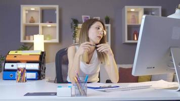 Young woman works bored at home office. Unhappy business woman working on computer in home office. video