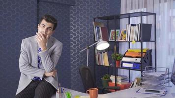 Businessman is worried and thoughtful in the office. The businessman working in the office is unhappy and things are not going well. video