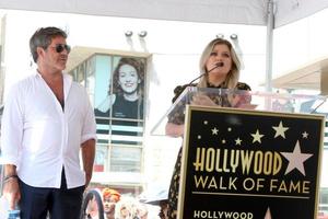 LOS ANGELES - AUG 22 - Simon Cowell, Kelly Clarkson at the Simon Cowell Star Ceremony on the Hollywood Walk of Fame on August 22, 2018 in Los Angeles, CA photo