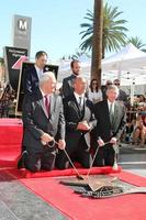 LOS ANGELES - DEC 13 - Thomas Rothman, Dwayne Johnson, Leron Gubler, Officials at the Dwayne Johnson Star Ceremony on the Hollywood Walk of Fame on December 13, 2017 in Los Angeles, CA photo