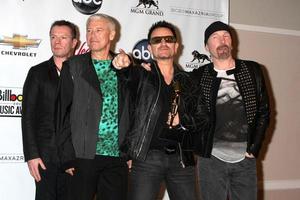 LAS VEGAS, MAY 22 - U2 Larry Mullen Jr, Adam Clayton, Bono and The Edge in the Press Room of the 2011 Billboard Music Awards at MGM Grand Garden Arena on May 22, 2010 in Las Vegas, NV photo