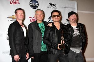 LAS VEGAS, MAY 22 - U2 Larry Mullen Jr, Adam Clayton, Bono and The Edge in the Press Room of the 2011 Billboard Music Awards at MGM Grand Garden Arena on May 22, 2010 in Las Vegas, NV photo