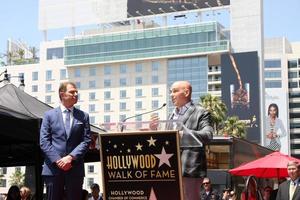 LOS ANGELES, JUN 2 - Bobby Flay, Michael Symon at the Bobby Flay Hollywood Walk of Fame Ceremony at the Hollywood Blvd on June 2, 2015 in Los Angeles, CA photo
