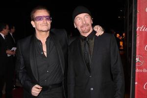 PALM SPRINGS, JAN 4 - Bono, The Edge at the Palm Springs Film Festival Gala at Palm Springs Convention Center on January 4, 2014 in Palm Springs, CA photo