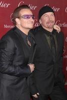 PALM SPRINGS, JAN 4 - Bono, The Edge at the Palm Springs Film Festival Gala at Palm Springs Convention Center on January 4, 2014 in Palm Springs, CA photo