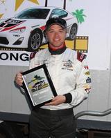 LOS ANGELES, APR 11 - Brett Davern, Pole Winner with fastest qualifying time for the Celebrities at the 2014 Pro Celeb Race Qualifying Day at Long Beach Grand Prix on April 11, 2014 in Long Beach, CA photo