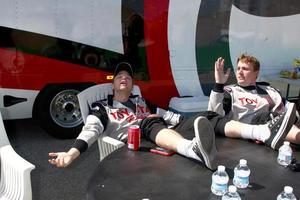 LOS ANGELES, MAR 23 - Brett Davern, Dakota Meyer Medal of Honor Winner aetting some sun during a break at the 37th Annual Toyota Pro Celebrity Race training at the Willow Springs International Speedway on March 23, 2013 in Rosamond, CA   EXCLUSIVE PHOTO