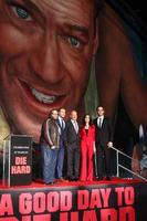LOS ANGELES, JAN 31 - L-R John Moore, Jai Courtney, Bruce Willis, Yuliya Snigir and Radivoje Bukvic at the A Good Day to Die Hard mural unveiling event at the 20th Century Fox Studios on January 31, 2013 in Los Angeles, CA photo