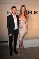 LOS ANGELES, OCT 26 - Chief Creative Officer of Burberry Christopher Bailey and actress Rosie Huntington-Whiteley arriving at the Burberry Body Launch at Burberry on October 26, 2011 in Beverly Hills, CA photo