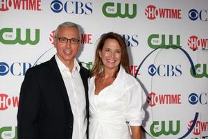 LOS ANGELES, AUG 3 - Drew Pinsky and wife arriving at the CBS TCA Summer 2011 All Star Party at Robinson May Parking Garage on August 3, 2011 in Beverly Hills, CA photo