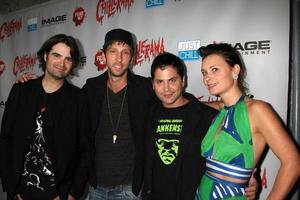 LOS ANGELES, SEP 15 - Joe Lynch, Joel David Moore, Adam Green, guest arrives at the Chillerama Premiere at Hollywood Forever Cemetary on September 15, 2011 in Los Angeles, CA photo