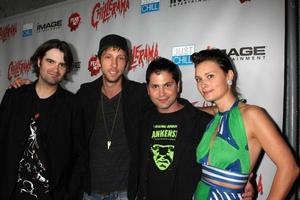 LOS ANGELES, SEP 15 - Joe Lynch, Joel David Moore, Adam Green, guest arrives at the Chillerama Premiere at Hollywood Forever Cemetary on September 15, 2011 in Los Angeles, CA photo