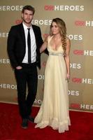 LOS ANGELES, DEC 11 - Liam Hemsworth, Miley Cyrus arrives at the 2011 CNN Heroes Awards at Shrine Auditorium on December 11, 2011 in Los Angeles, CA photo