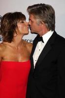 LOS ANGELES, OCT 23 - Lisa Rinna, Harry Hamlin arrives at the 2010 Carousel of Hope Ball at Beverly HIlton Hotel on October 23, 2010 in Beverly Hills, CA photo