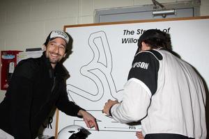 LOS ANGELES, MAR 17 - Adrien Brody Brody Jenner at the training session for the 36th Toyota Pro Celebrity Race to be held in Long Beach, CA on April 14, 2012 at the Willow Springs Racetrack on March 17, 2012 in Willow Springs, CA photo